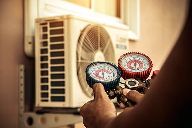 Professional Air Conditioning Service technician working in Pine Level, NC